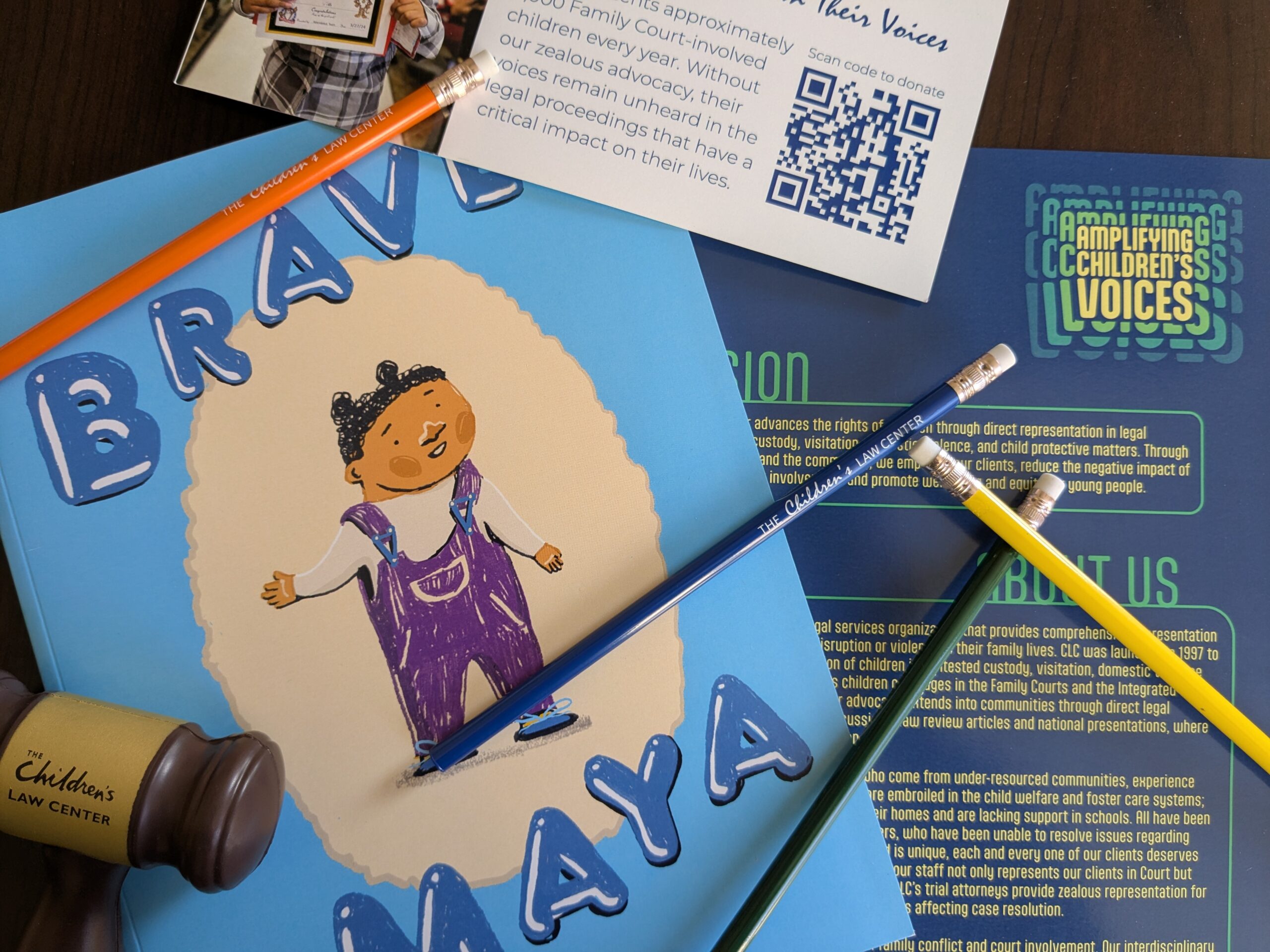 Colorful papers and pencils on a desk.