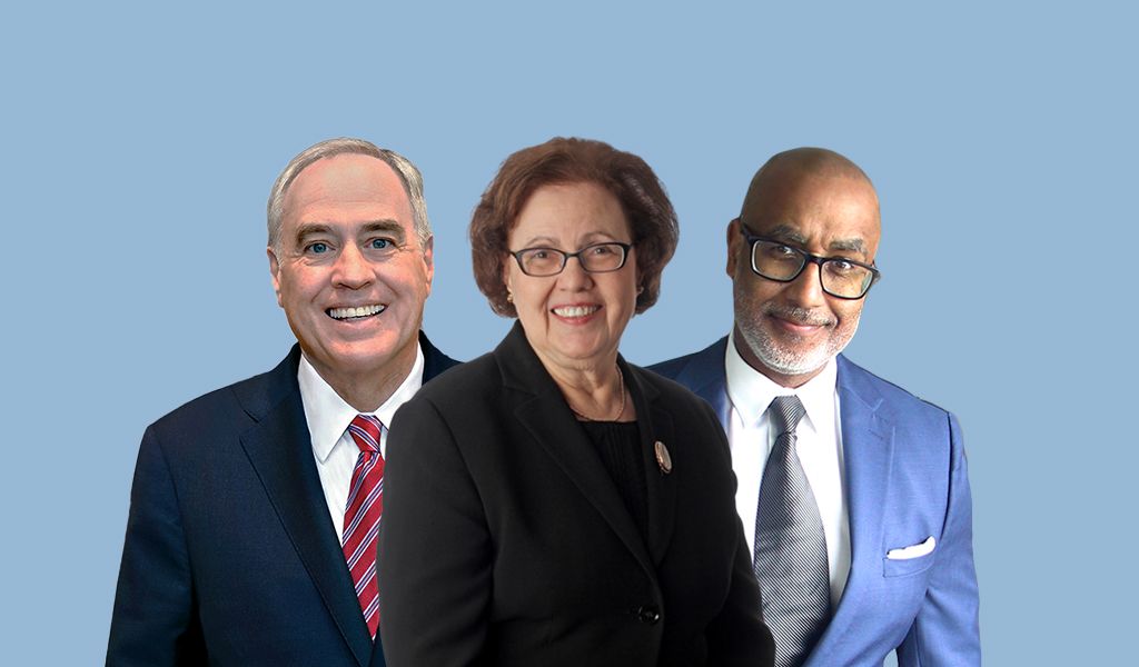 The event's three honorees stand side-by-side, smiling against a blue backdrop.